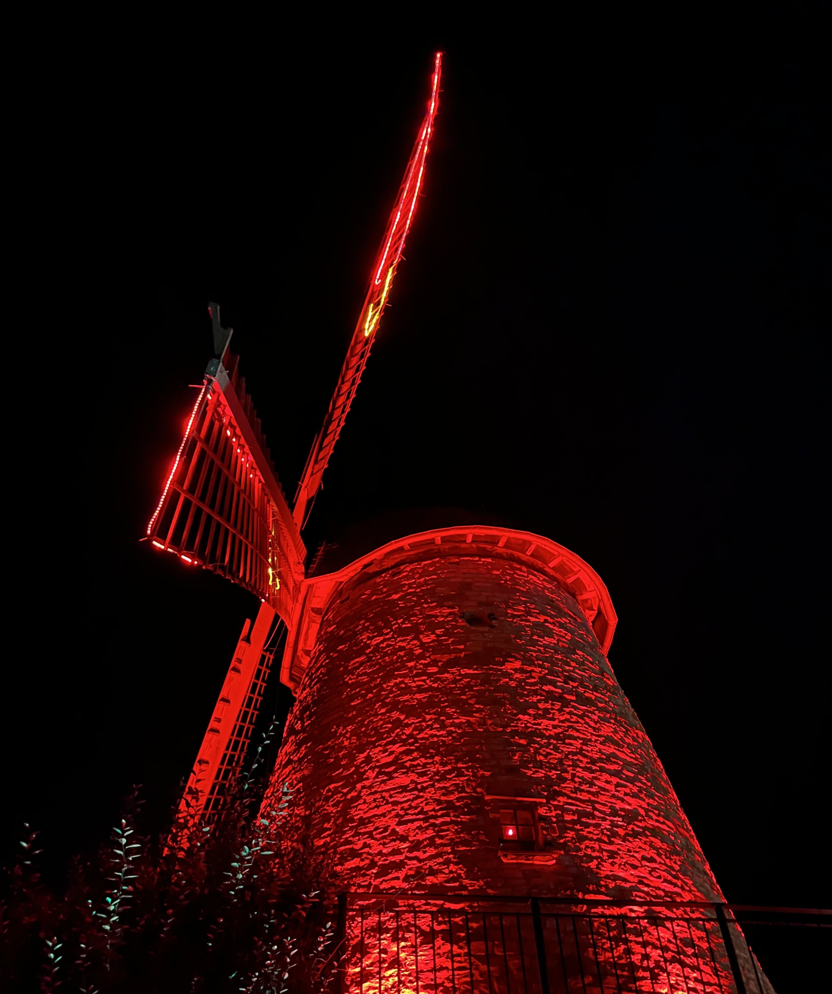 Windmill illuminated in red